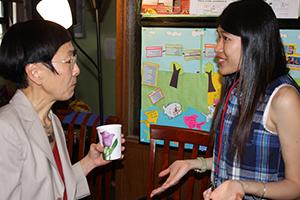 Student talking to a professor at an Intercultural Center event